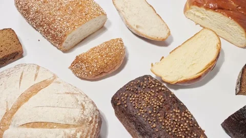 Different kinds of fresh bakery breads with slices 動画素材 158880157