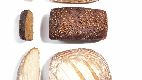 Different kinds of fresh bakery breads with slices 動画素材 158880416