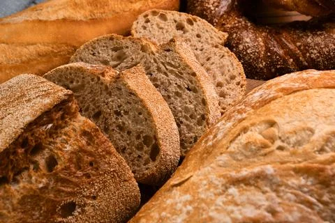 Different kinds of fresh bread as background Stock Photos