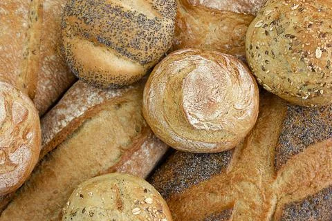 Different kinds of fresh bread as background, Top view. 스톡 사진