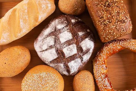 Different kinds of fresh bread on a tray. Stock Photos
