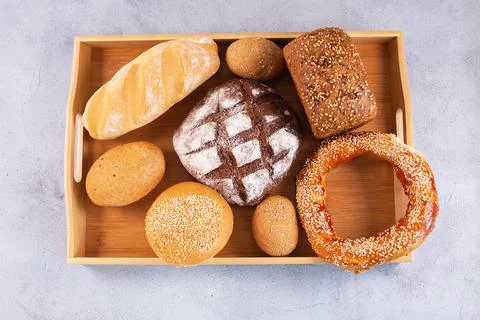 Different kinds of fresh bread on a tray. Stock Photos