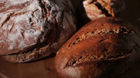 Different kinds of fresh organic bread loaves in a traditional artisan bakery. Stock Footage 145973346
