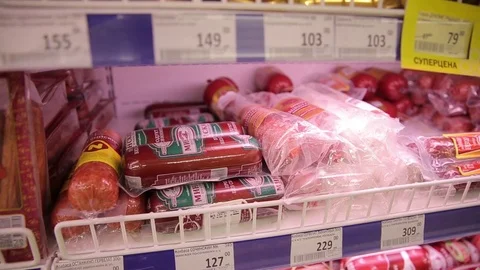 Different kinds of meat products on the display in the grocery store, close-ups Stock Footage 75488828