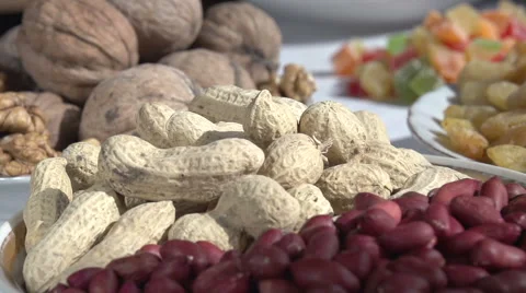 Different kinds of nuts and dried fruit Stock Footage 48039149