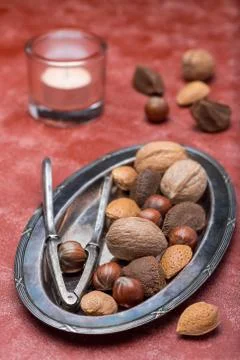 Different kinds of nuts in the shell: hazelnut, walnut, almond and brazil nut Photos