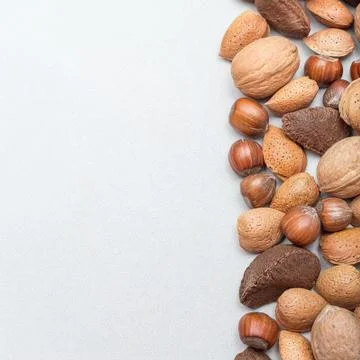 Different kinds of nuts in shell, hazelnut, walnut, almond and brazil nuts 스톡 사진