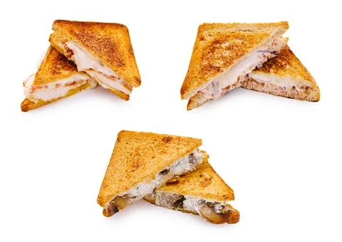 Different kinds of sandwiches on a plain surface with toasted bread Stock Photos