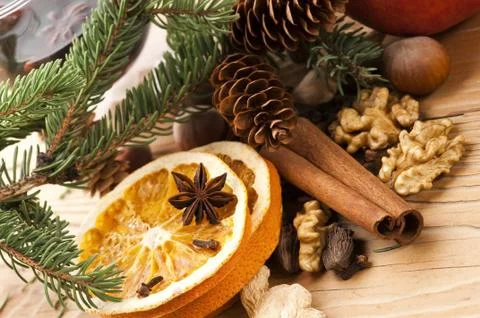 Different kinds of spices, nuts and dried oranges - christmas decoration Stock Photos