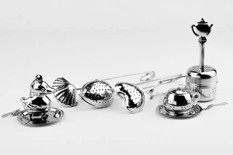 Different kinds of stainless tea strainers isolated on white background Stock Photos