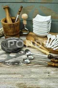 Different Kitchen Accessories From Tin, Olive Wood And Ceramic