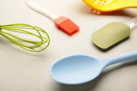 Different kitchenware on a grey background top view. Cooking appliances. Stock Photos