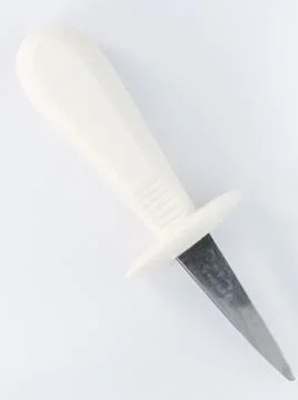 A different knife with white plastic handle Stock Photos