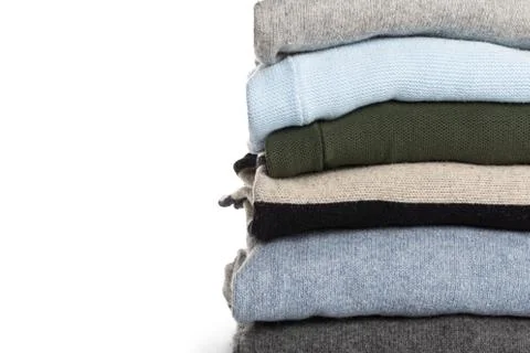 Different knitted sweaters on a isolated background Stock Photos