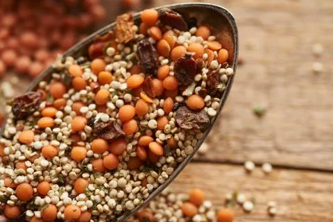 Different legumes on old silver spoon Stock Photos