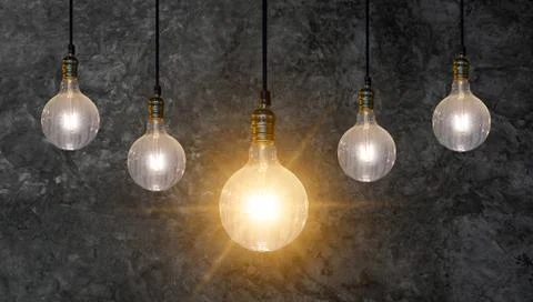 Different Light bulb idea Many bulbs are arranged in a row and one of them is Stock Photos