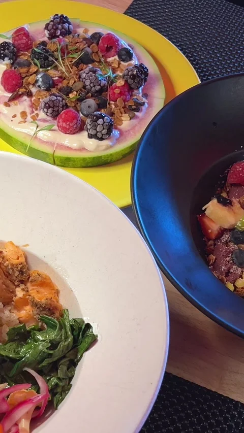 Different lunch dishes fruit salad watermelon with berries plate with eggs Stock Footage 294529934