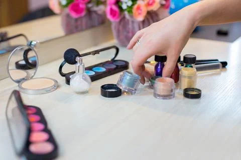 Different makeup items on the table Stock Photos