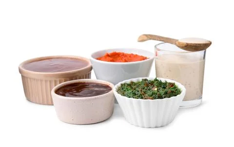 Different marinades in tableware isolated on white Stock Photos