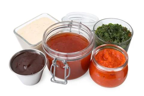 Different marinades in tableware isolated on white Stock Photos