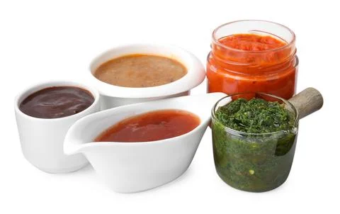 Different marinades in tableware isolated on white Stock Photos