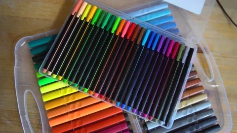 Different markers on a wooden table Stock Footage 159863496