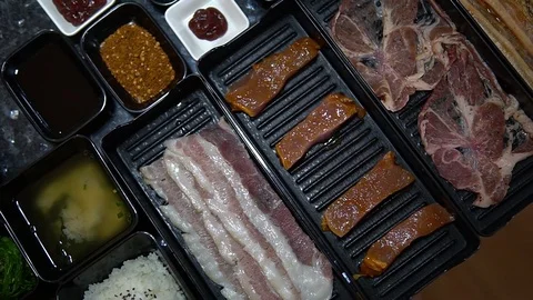 Different meat and beef for Bar B Que buffet grill in buffet restaurant Stock Footage 77432289