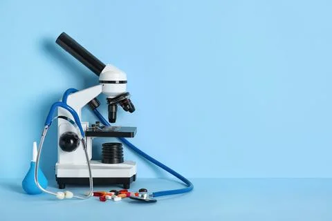 Different medical tools with microscope on blue background. Nobel Prize Day Photos