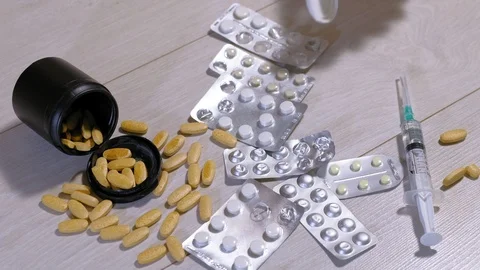 Different medicinal tablets on the floor. Suicide 스톡 동영상 111521925