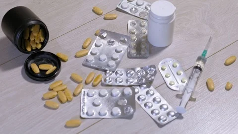 Different medicinal tablets on the floor. Suicide Stock-Footage 111522178