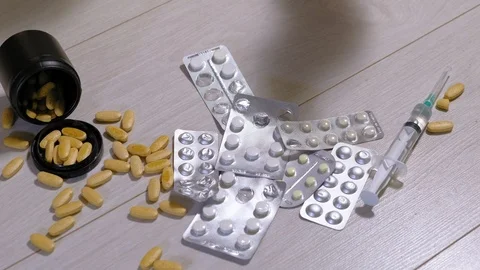 Different medicinal tablets on the floor. Suicide Stock Footage 111522426