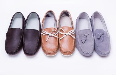 Different moccasins for a boy Stock Photos