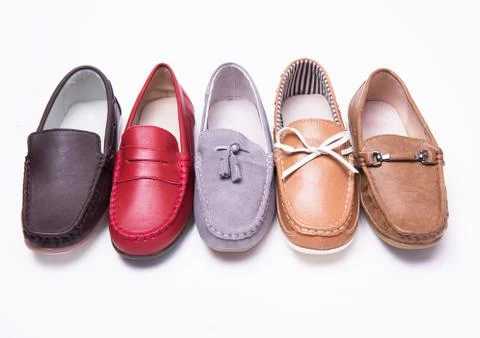Different moccasins for a boy Stock Photos