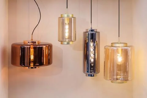 Different modern streamlined mirror copper chandeliers. Bubble metal copper s Stock Photos