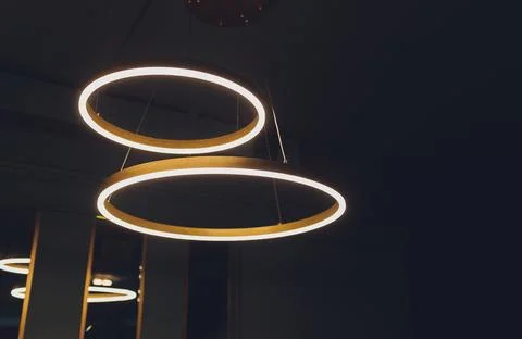 Different modern streamlined mirror copper chandeliers. Bubble metal copper Stock Photos