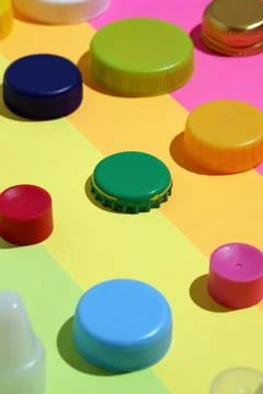 Different multi-colored bottle caps, metal and plastic Stock Photos