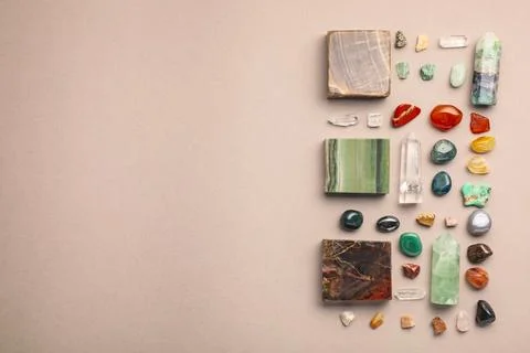 Different natural gemstones on light background, flat lay. Space for text 스톡 사진