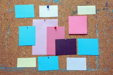 Different notes on old cork board. Copy space Stock Photos