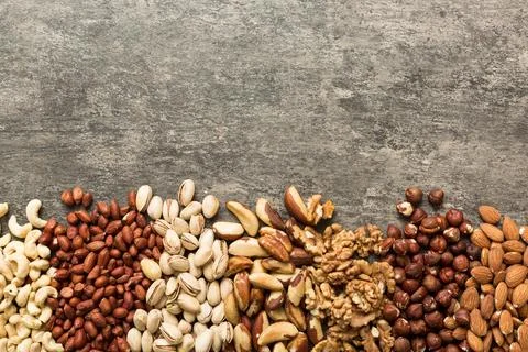 Different nuts frame background. Close up, top view, flat lay with vopy spa.. Stock Photos