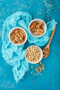 Different nuts on gray background Stock Photos