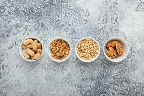Different nuts on gray background Stock Photos