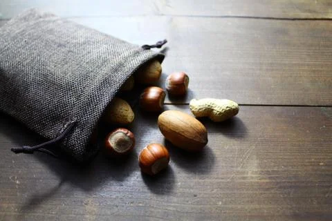 Different nuts in a jute sack Stock Photos