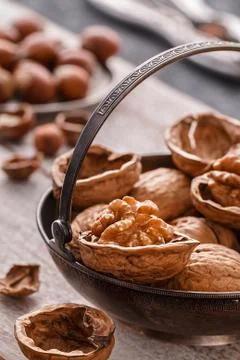 Different nuts on rustic  table. hazelnut,  walnuts Stock Photos