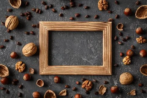 Different nuts on stone table. Cedar, hazelnut, walnuts Stock Photos