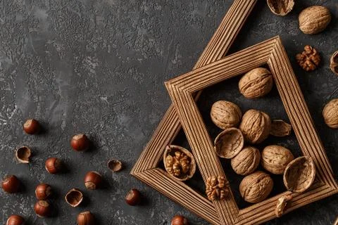 Different nuts on stone table. hazelnut, walnuts Stock Photos
