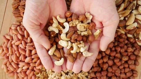 Different nuts on the table. Video stock 224440291