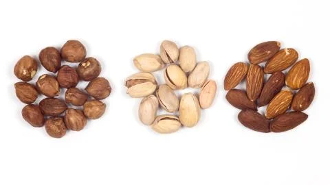 Different nuts on a white background. Almond, hazelnut, pistachio. Foto stock