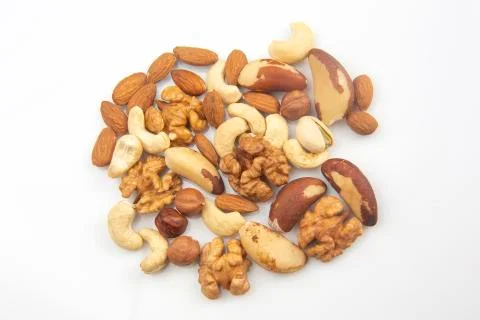 Different nuts on a white background. protein and healthy food Stock Photos
