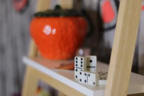 Different objects including a camera and red glass box   and domino Stock Photos