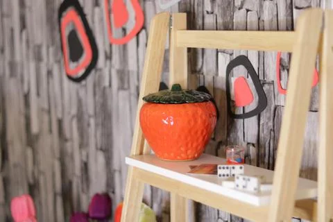 Different objects including a red glass box and Wristwatch flowers and domino Stock Photos